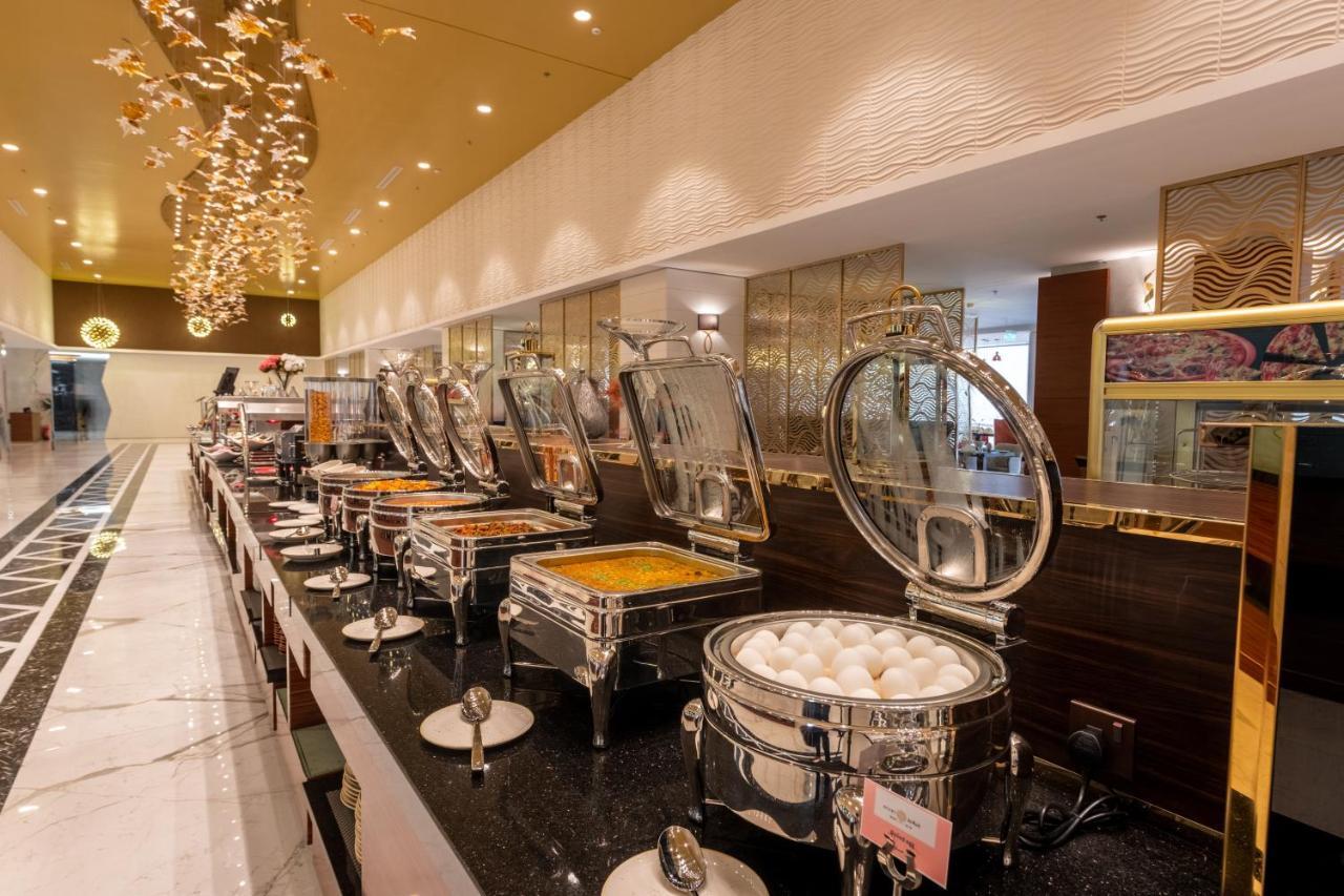 Nivel Hotel Abha Khamis Mushait Exterior photo A buffet at a hotel