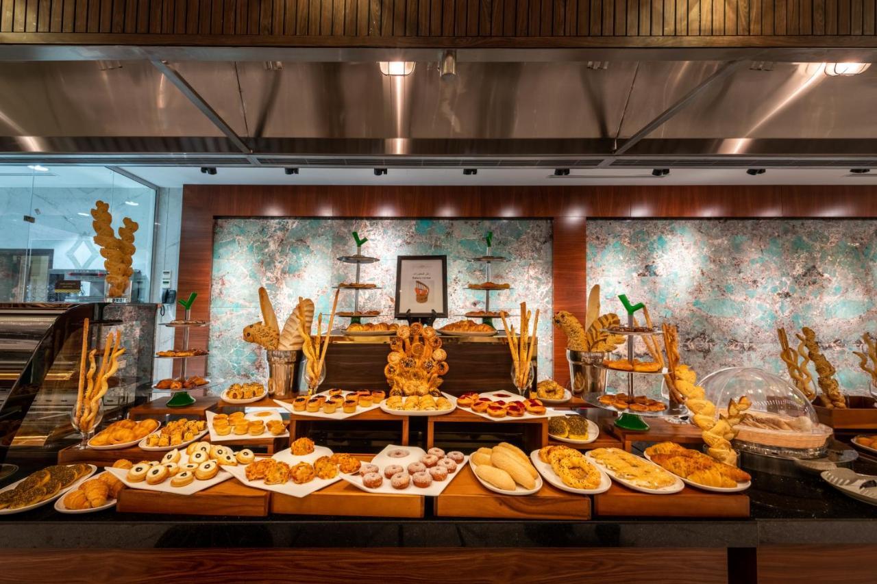Nivel Hotel Abha Khamis Mushait Exterior photo A dessert buffet