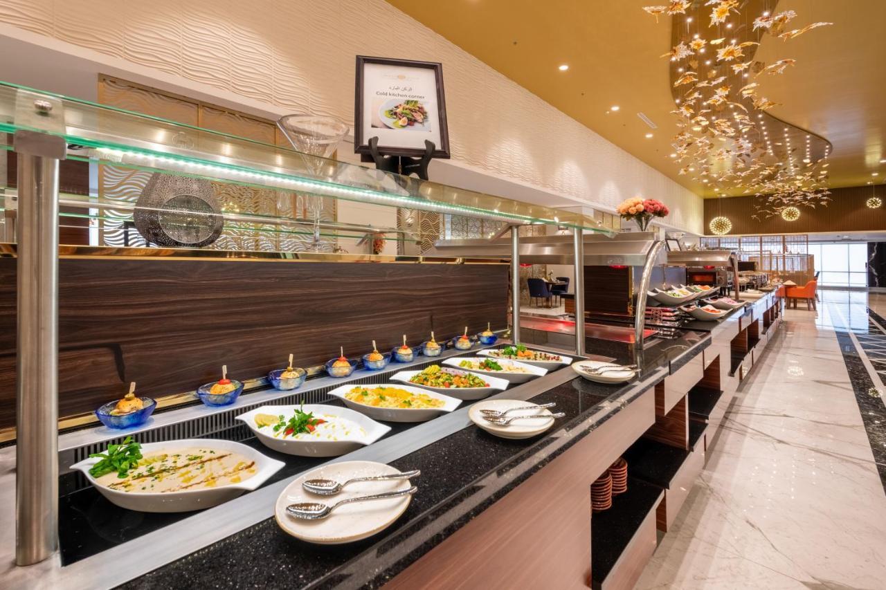 Nivel Hotel Abha Khamis Mushait Exterior photo A buffet at a hotel