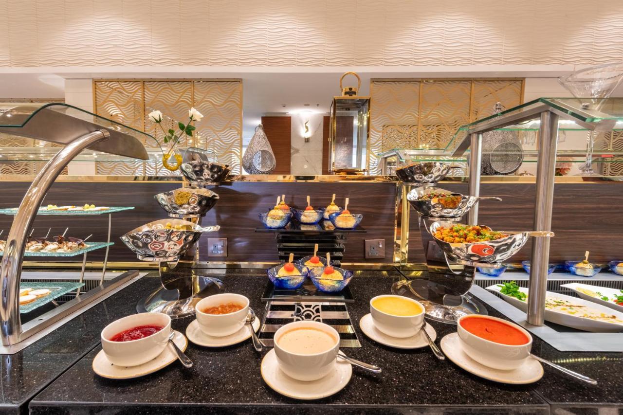Nivel Hotel Abha Khamis Mushait Exterior photo A buffet at a hotel